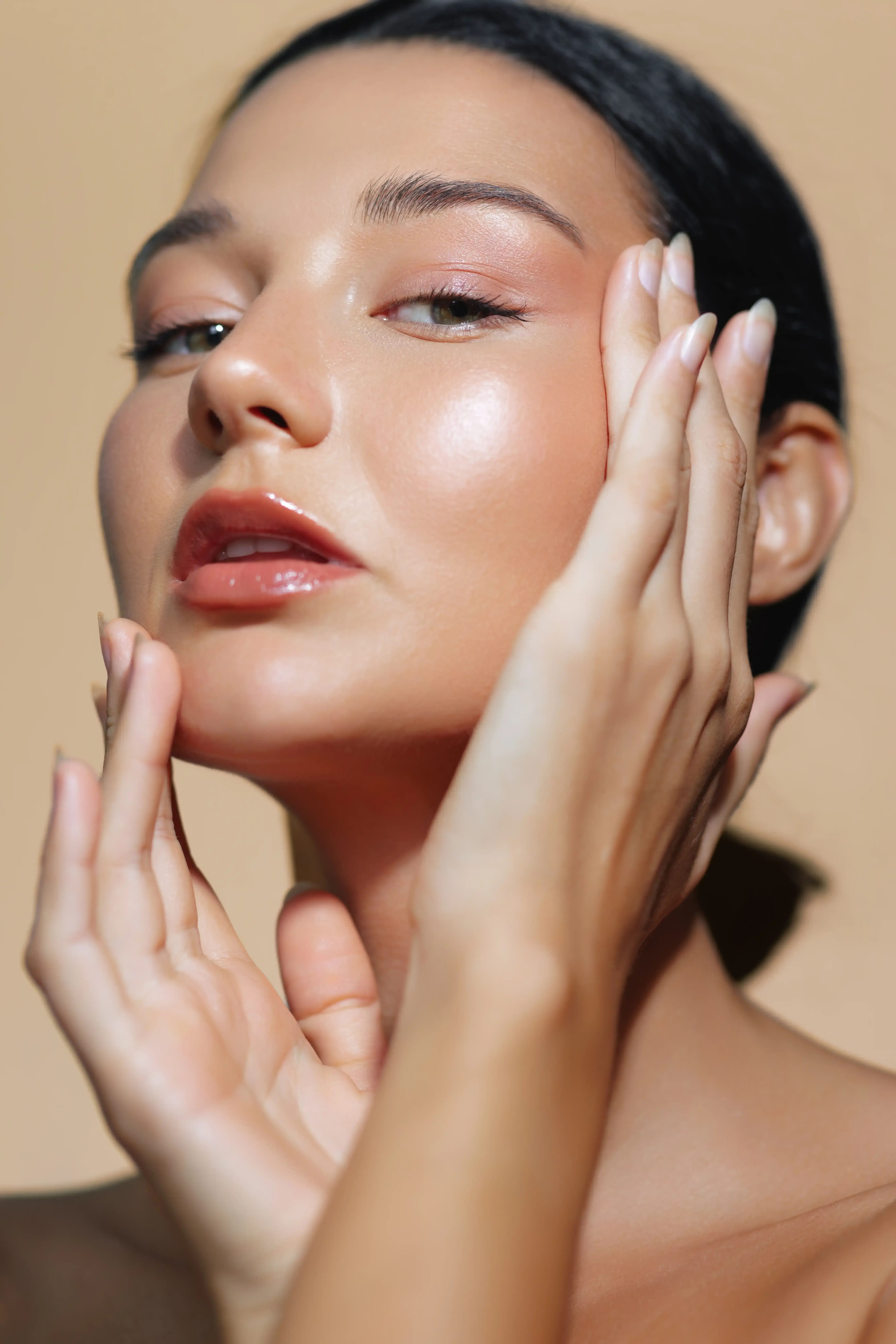 Close-up of uneven cheek texture and shallow depressions left by healed acne on adult skin